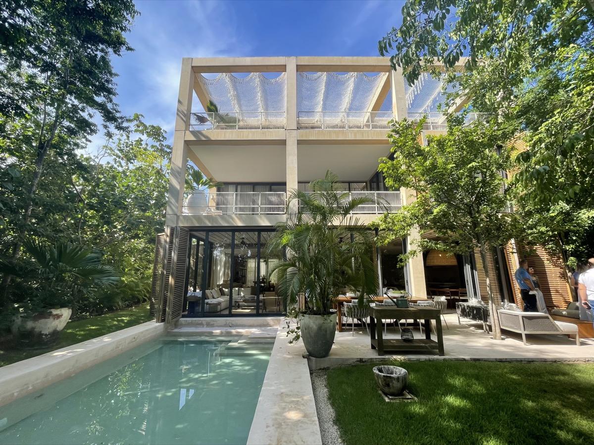 A modern residence with a private pool and tropical gardens