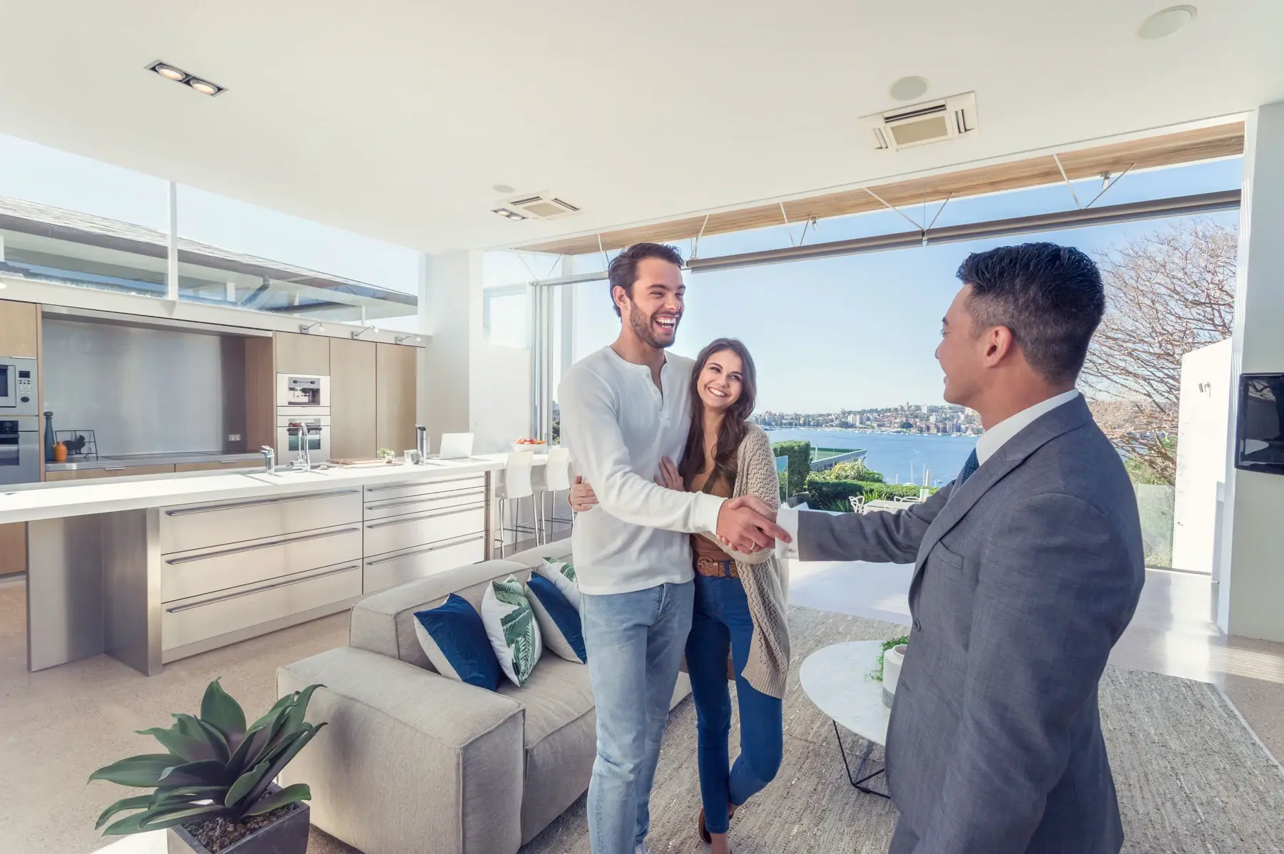 realtor shaking hands with clients